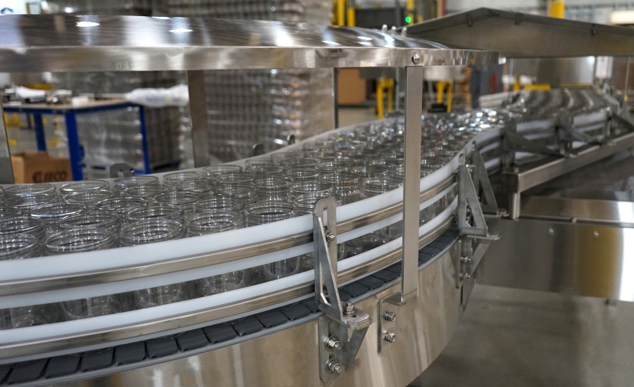 Image of glass jars being moved on conveyor