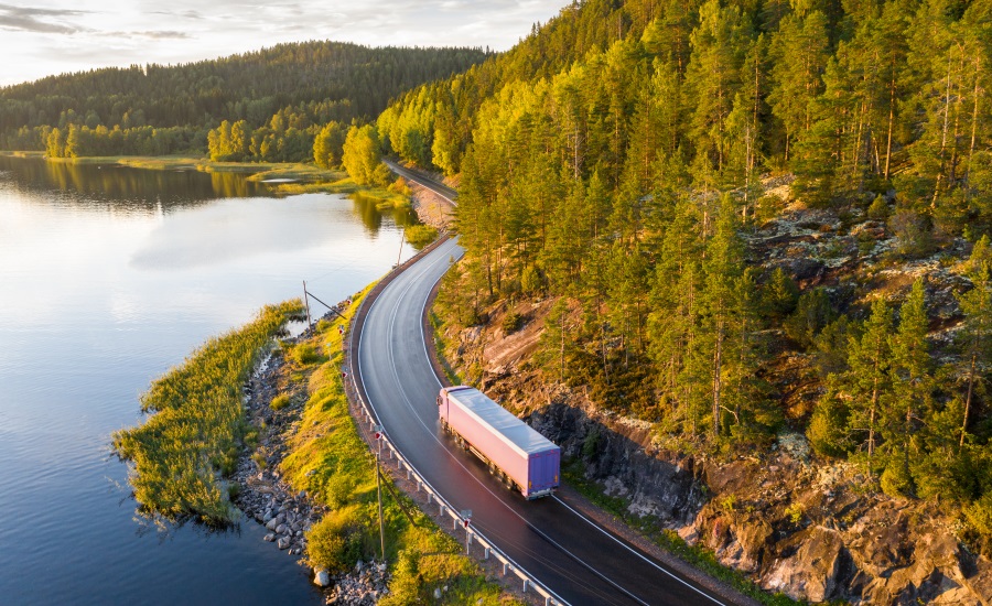 truck driving by forest